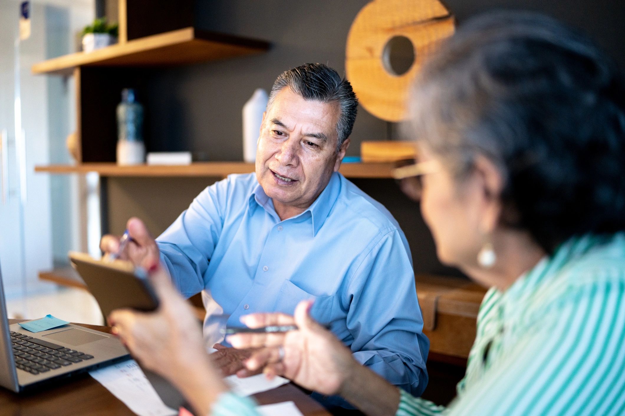 Couple meeting with a professional to discuss retirement planning