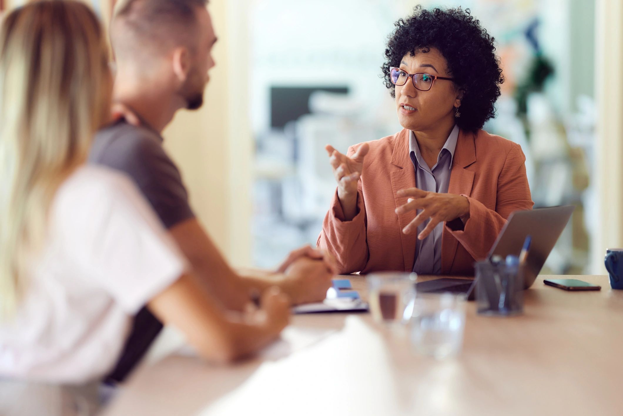 Advisor meeting with clients in an office setting
